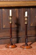 A pair of George III mahogany candle sticks