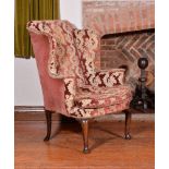 A George II walnut wing armchair