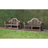 A pair of teak garden seats in the manner of designs by Lutyens