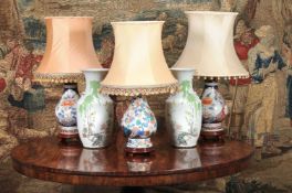 A pair of Chinese Imari style porcelain pear shaped vases