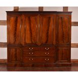 A mahogany breakfront wardrobe