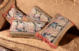 A set of four cushions incorporating 18th century tapestry fragments