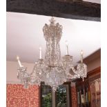 A cut glass eight light chandelier in late George III style