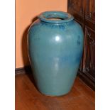 A large turquoise-glazed stoneware vase