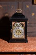 A George I gilt metal mounted ebonised table clock