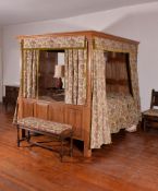 A carved oak four post bed