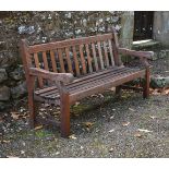 A stained teak garden bench