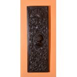 A carved oak panel, late 16th/early 17th century,
