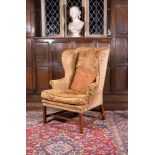 A George III mahogany wing armchair, circa 1780