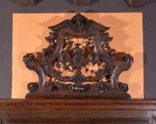 A carved walnut overdoor or wall panel, 19th century, in the Baroque taste