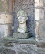 A sculpted white marble bust of a man