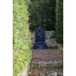A black painted cast iron wall fountain