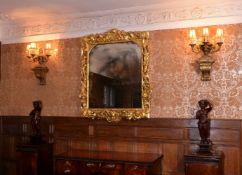 A carved giltwood wall mirror