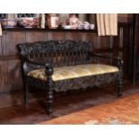 A Ceylonese solid ebony settee