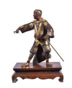 A Parcel Gilt Bronze Figure of an Entertainer
