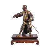 A Parcel Gilt Bronze Figure of an Entertainer