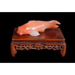 A Chinese or Japanese Carnelian agate small carp carving