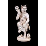 ϒ SHUNKO (TOSHIMITSU): A Japanese Ivory Okimono carved as smiling Oni dancing on one leg