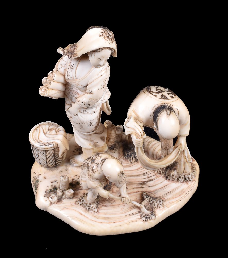 ϒ KIKKOSAI TOKUSAN: A Japanese Ivory Okimono depicting a family group - Image 3 of 4