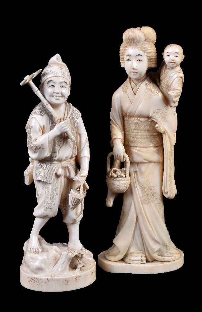 ϒ A Japanese Ivory Okimono of a Farmer with matchlock rifle