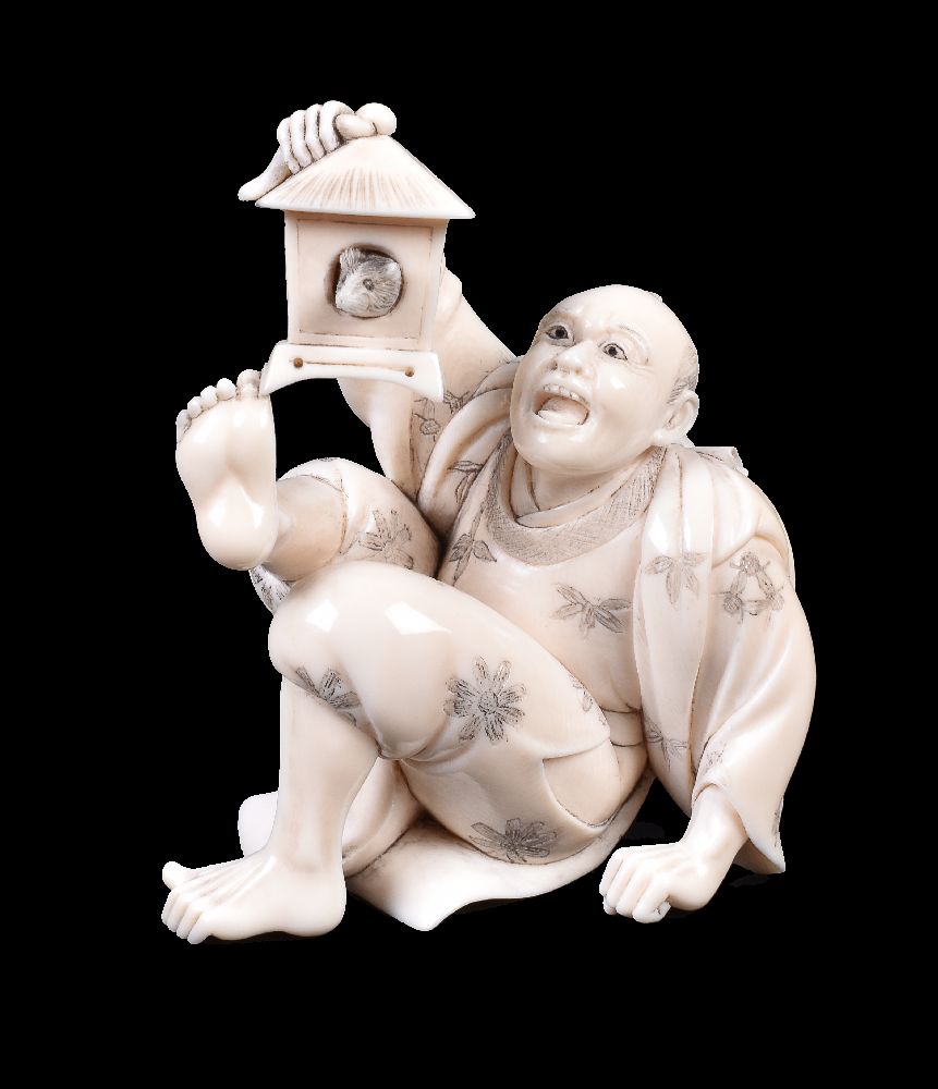 ϒ SEISHUN: A Japanese Ivory Okimono of a man falling backwards in surprise