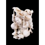 ϒ KOGYOKU: A Japanese Ivory Okimono of a Yamabushi kneeling under the weight of a giant conch shell