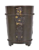 A Japanese Bronze Cup of tapered cylindrical form resting on three feet