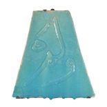 A Persian turquoise glazed moulded calligraphic tile