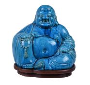 A Chinese turquoise glazed figure of Budai