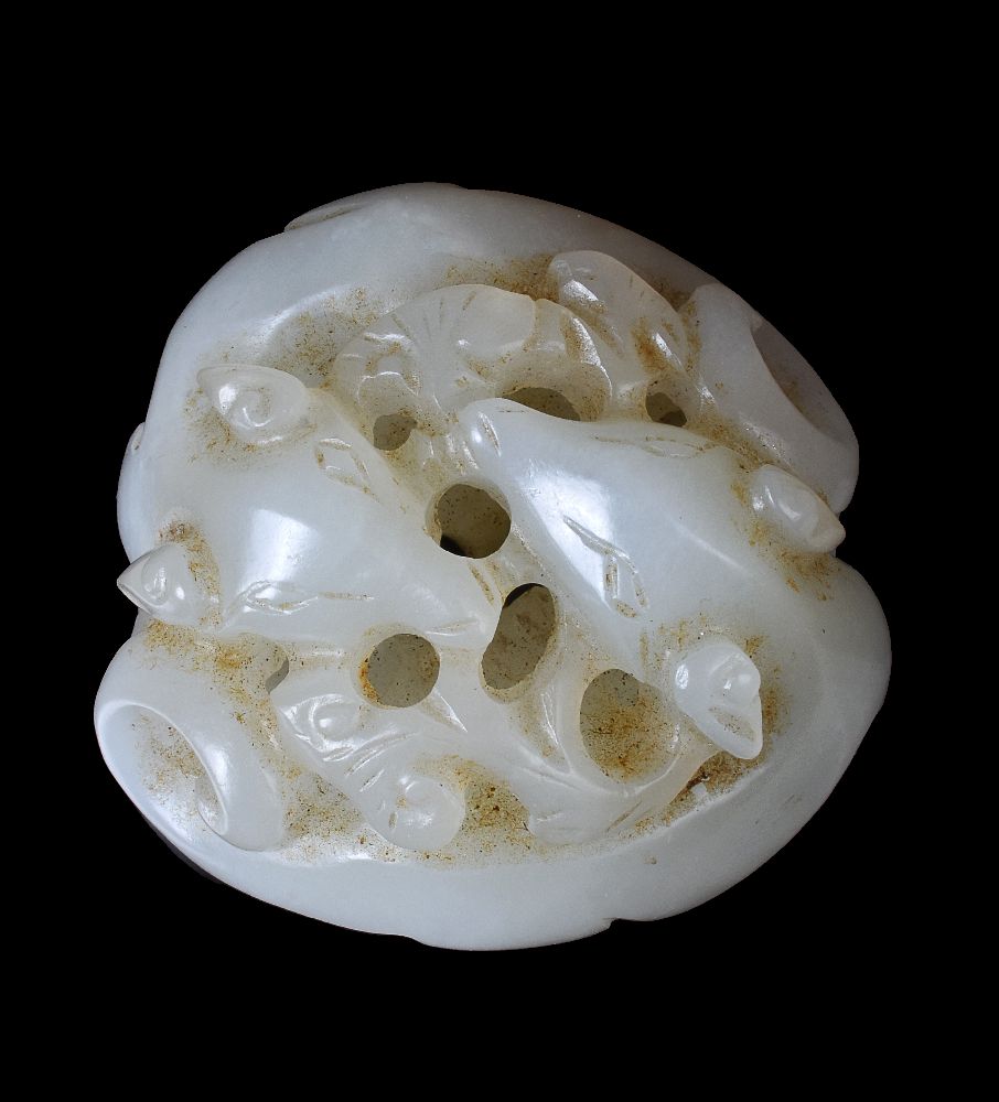 A Chinese white jade carving of two dogs