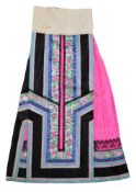 A finely pleated Chinese skirt in vibrant pink silk damask