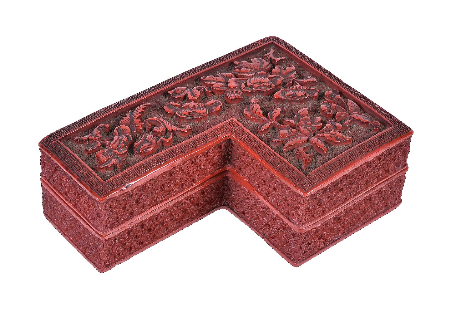 A Chinese Cinnabar shaped box and cover