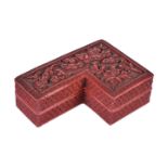 A Chinese Cinnabar shaped box and cover