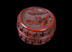 A small Chinese cinnabar lacquer circular box and cover