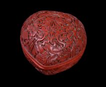 A small Chinese carved cinnabar peach-form box and cover