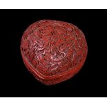 A small Chinese carved cinnabar peach-form box and cover