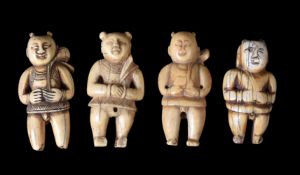 ϒ A group of four Chinese carved ivory toggles of boys