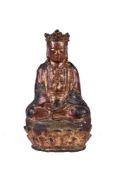 A Chinese lacquered bronze seated figure of Gunayin