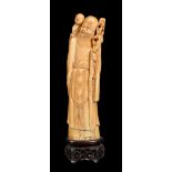 ϒ A Chinese ivory standing figure of Shoulao with attendant