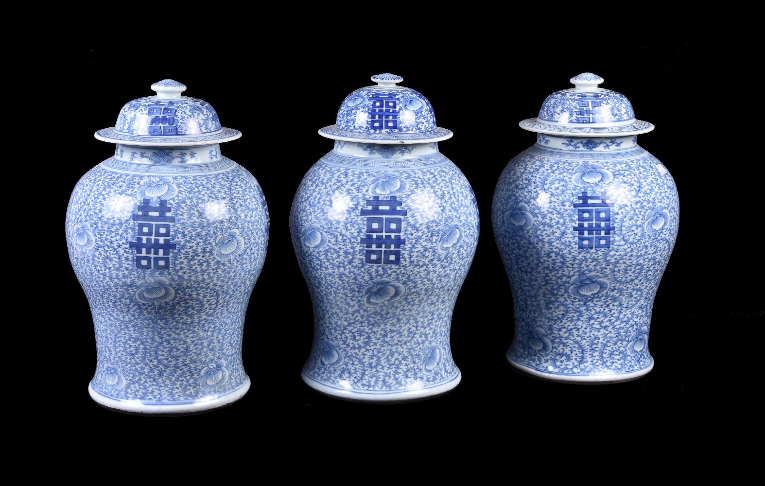 Three Chinese blue and white 'Marriage' vases and covers