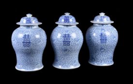 Three Chinese blue and white 'Marriage' vases and covers