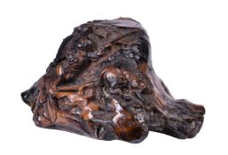 ϒ A Chinese 'black coral' or 'root amber' hunting scene carving
