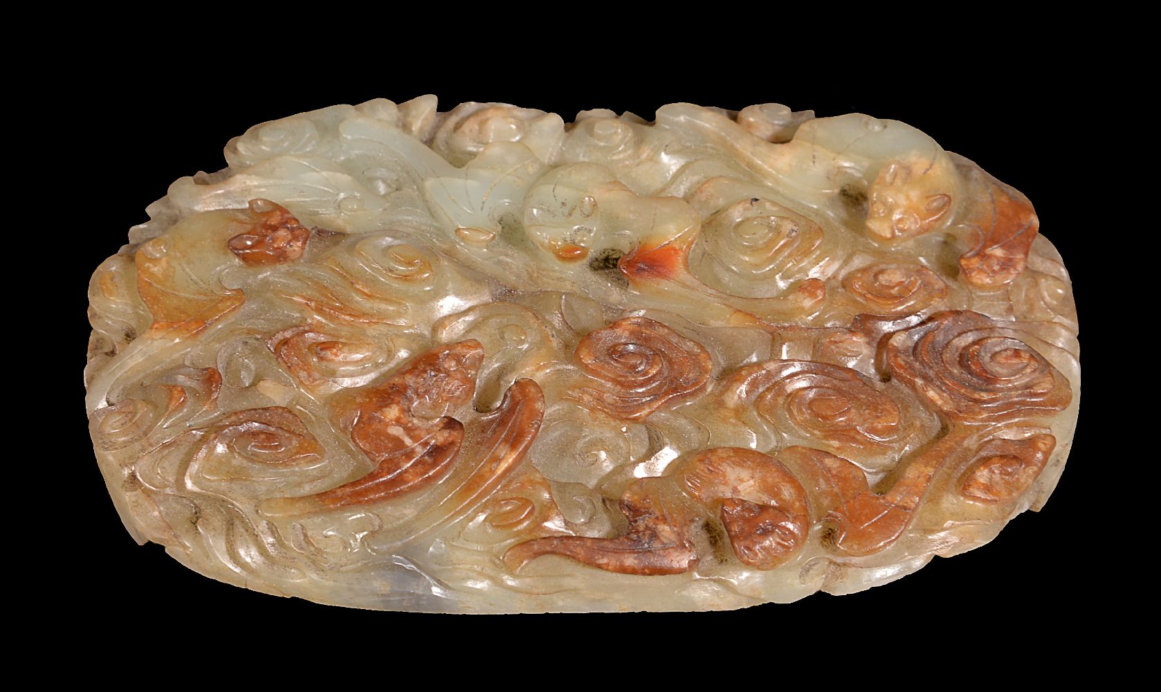 A Chinese celadon and russet jade ‘longevity’ belt plaque