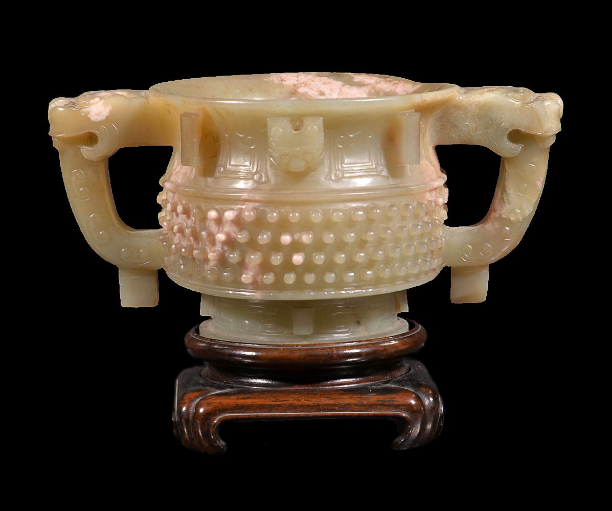 A Chinese celadon and white jade two handled cup