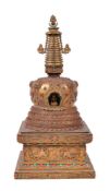 ϒ A gilt-bronze Buddhist stupa
