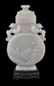 A Chinese pale celadon jade vase on spinach green jade stand