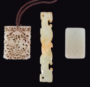 A Chinese celadon and russet jade plaque