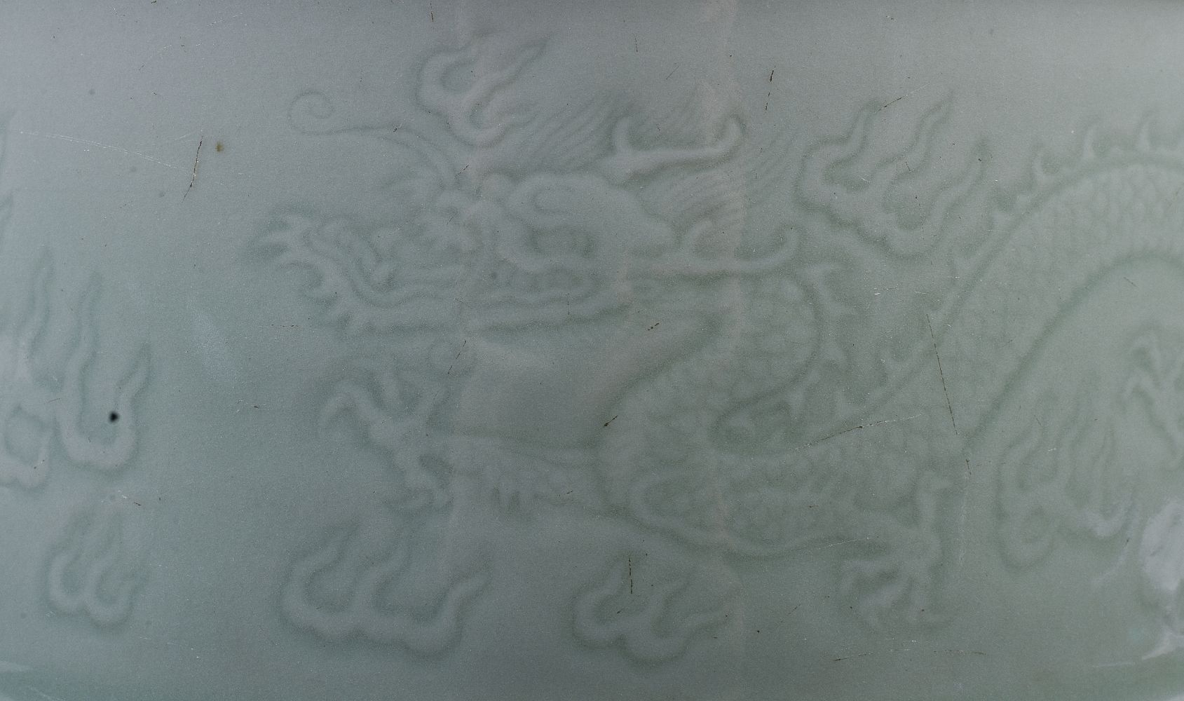 A Chinese celadon-glazed ‘dragon’ brush pot - Image 2 of 5