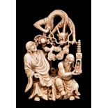 ϒ A carved ivory group of Luohan and dragon