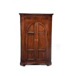 A mahogany standing corner cupboard, circa 1780 and later